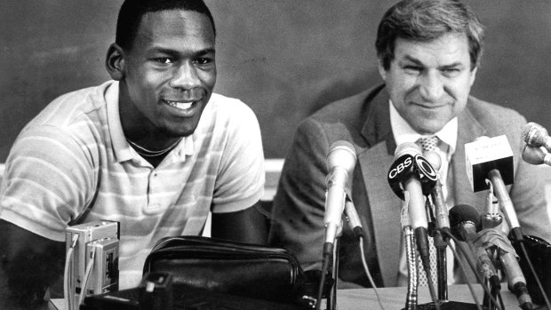 FILE - in this May 5, 1984 file photo, North Carolina guard Michael Jordan, left, and Tar Heels coach Dean Smith are shown at a news conference in Chapel Hill, N.C., where Jordan announced he would forfeit his final year of college eligibility to turn pro.