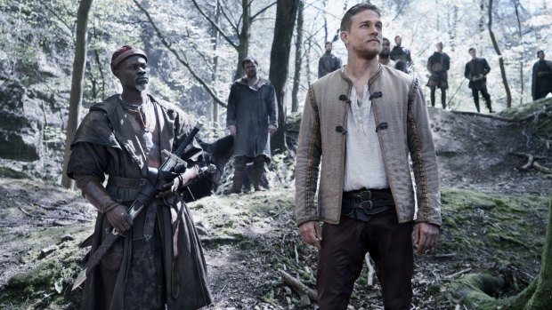 Charlie Hunnam as king-to-be Arthur (right) with Neil Maskell as Back Lack in 'King Arthur: Legend of the Sword'.