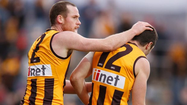 Jarryd Roughead congratulates teammate James Frawley who kicked three goals in the win over Brisbane.