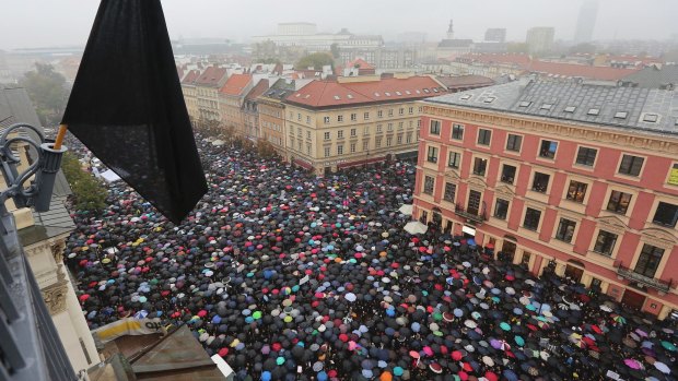 Thousands of women participate in the nationwide Black Monday strike to protest a legislative proposal for a total ban on abortion in Warsaw, Poland, earlier this month.