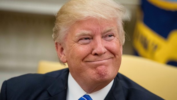 Donald Trump smiles while meeting with Abu Dhabi's Crown Prince Sheikh Mohammed bin Zayed Al Nahyan on Monday.