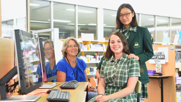 Teacher Rachel Lilley with students Elizabeth Son and Anna Costa Lopes. Ms Lilley has developed a course to enhance students' IT and communications skills. 