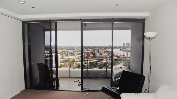 The scene of the tragedy: looking out from Tostee’s unit to the balcony where he isolated her, and the railing over which she climbed before falling to the ground.