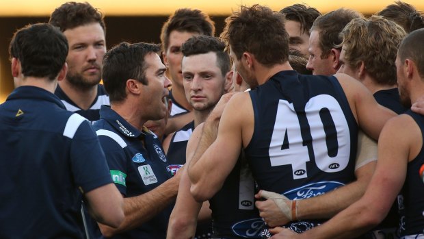 Cats coach Chris Scott urges his players on at three-quarter-time on Sunday.