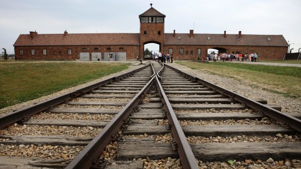 Railway tracks lead into the  Auschwitz death camp.