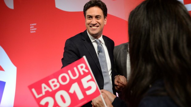 Leader of the opposition Labour Party, Ed Miliband smiles as he greets supporters in Leeds, northern England on Wednesday.