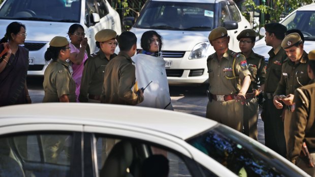 India's most famous prisoner of conscience is escorted by police for an appearance at Patiala House court in New Delhi.