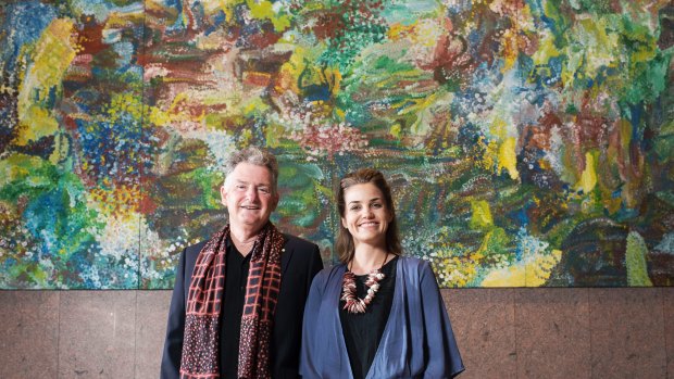 Adrian Newstead and Mirri Leven with Earth's Creation #1 by Emily Kame Kngwarreye, which was expected to fetch at least $2 million at auction until an epic IT meltdown.