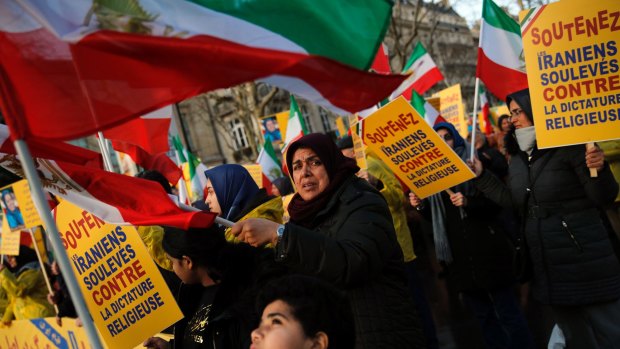 Opposition demonstrators protest near the Iranian embassy in Paris on Wednesday.