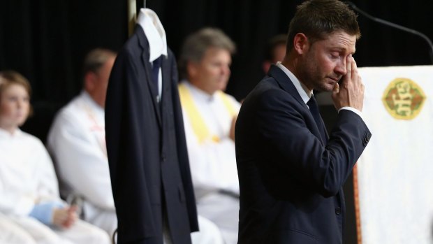 "I keep looking for him, I know it's crazy": Michael Clarke fights through tears as he speaks at the service. 
