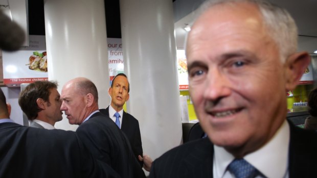 Prime Minister Malcolm Turnbull is stalked by a Tony Abbott cut-out wielded by a member of the satirical Chaser program.