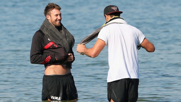 Bombers Cale Hooker and Tom Bellchambers during a recovery session on Monday.