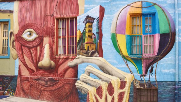Colourful murals decorate the walls of buildings in the historic port city of Valparaiso in Chile.