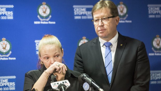 Police Minister Troy Grant and Graham Bourke's daughter Lee announce a $100,000 reward for information leading to an arrest over Mr Bourke's death.