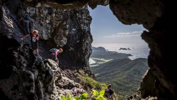 Walkers descending from Goat House Cave on Mt Lidgbird.