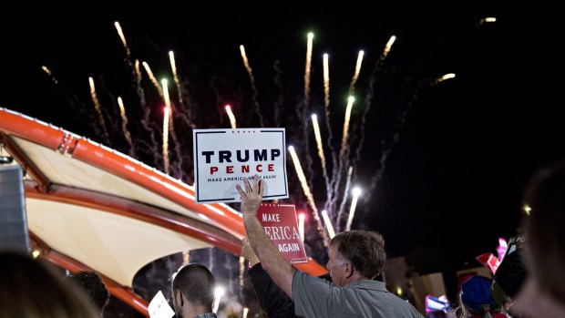 Fireworks explode during a campaign rally with Donald Trump, in Cedar Rapids, Iowa on Friday.