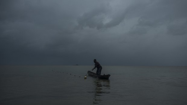 Byron Presida fishes from a dugout canoe off the shore of Bangkukuk Taik, Nicaragua, a remote village home to the Rama people.