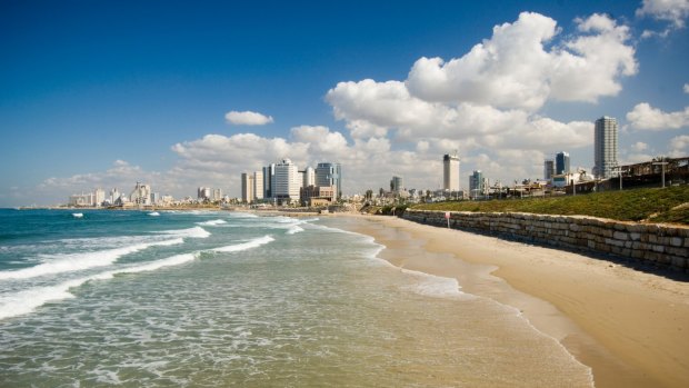 Warmth welcome: The beach and skyline at Tel Aviv.