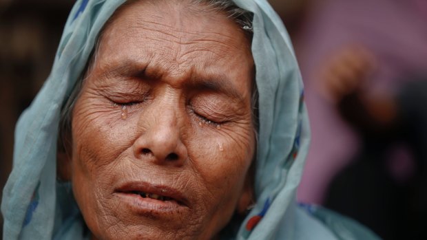Sufia Begum, a Rohingya who recently crossed over to Bangladesh, cries on December 2 as she describes her experiences in Myanmar's Rakhine state.