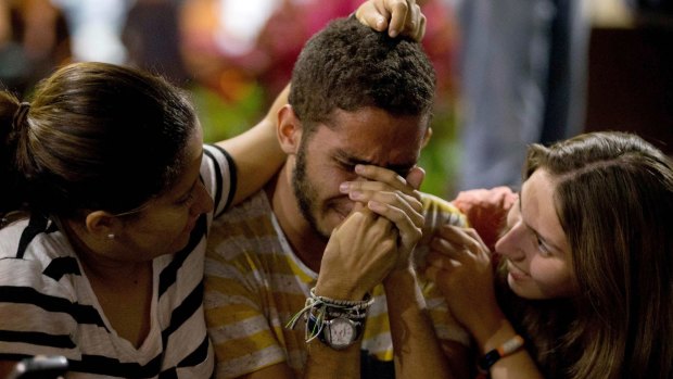 Supporters of opposition leader Leopoldo Lopez cry as they listen to his guilty verdict.