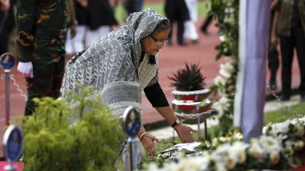 Bangladesh's Prime Minister Sheikh Hasina Wajed offers her tribute to the victims of an attack at a restaurant in Dhaka this month. 