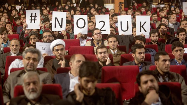 Iranian men hold up anti-British posters during an anti-British campaign in Tehran last week. 