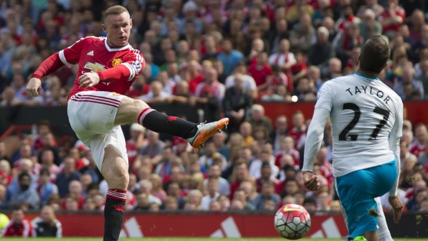Firing blanks: Manchester United's Wayne Rooney takes a shot against Newcastle's Steven Taylor.