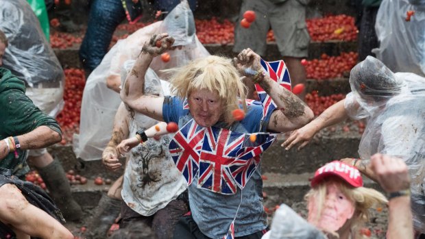 A man dressed as Boris Johnson takes part in a tomato fight at Britain's Glastonbury Festival  over the weekend.