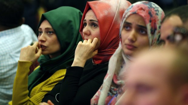 Supporters of Turkey's ruling Justice and Development Party watching television to monitor the election results on Sunday. 