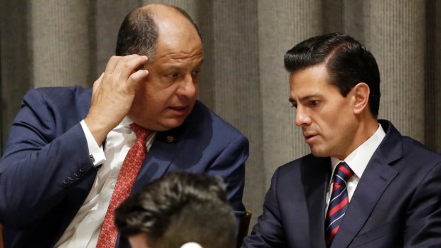 Costa Rican President Luis Guillermo Solis, left, and Mexican President Enrique Pena Nieto at the United Nations Summit for Refugees and Migrants, in at the UN on Monday.