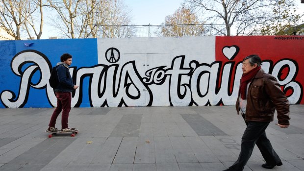 As Paris reeled from the worst attacks France has known since the end of World War II, its street artists took to city walls and billboards to paint notes of defiance. Here the words say 'Paris, I love you'.
