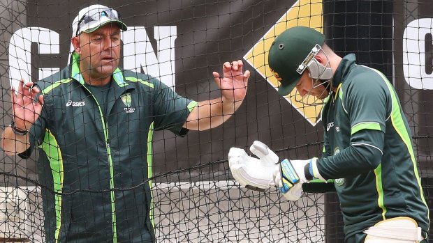 Coach Darren Lehmann has a word with Michael Clarke in the nets at the Adelaide Oval on Sunday,