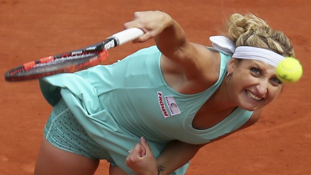 Victory: Timea Bacsinszky serves in her second round match of the French Open against Canada's Eugenie Bouchard at the Roland Garros stadium in Paris.