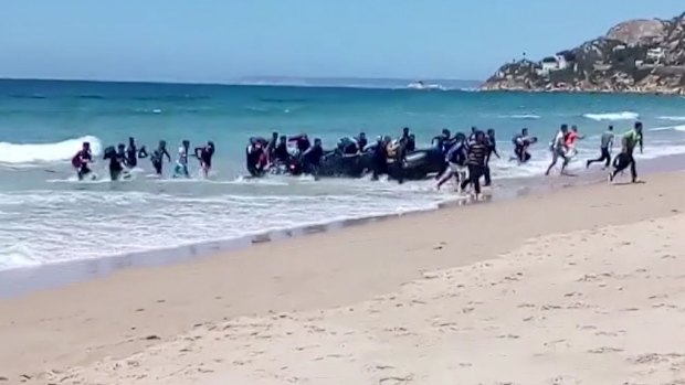 Beachgoers in Cadiz, Spain, say they watched migrants disembark from rubber boats on Wednesday and Thursday.