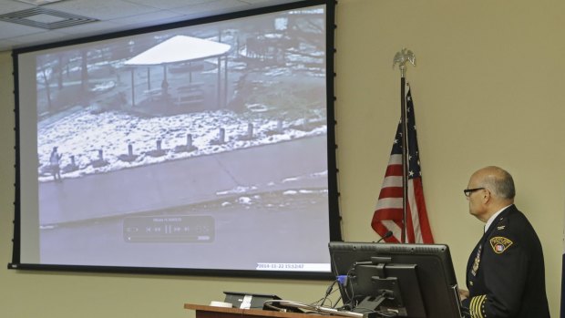 Transparent ... Cleveland Police Deputy Chief Ed Tomba, right, shows surveillance video of the police shooting of Tamir Rice.