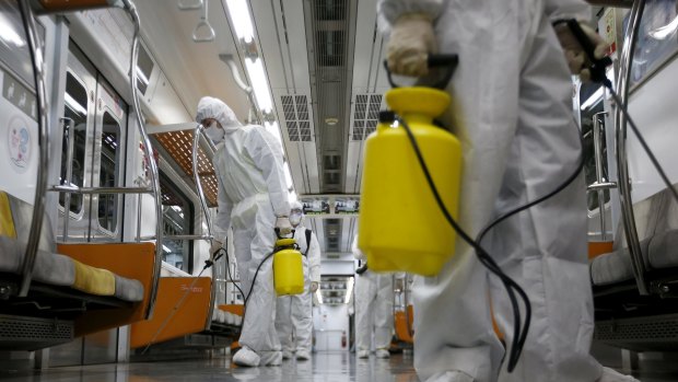 A subway train is disinfected in Goyang, South Korea, on Wednesday.