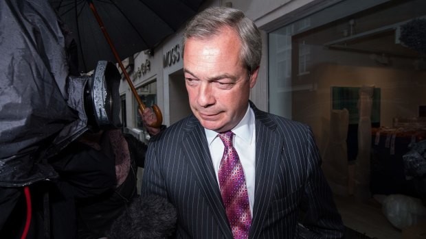 UK Independence Party (UKIP) leader Nigel Farage leaves the party's head offices in central London on Thursday.