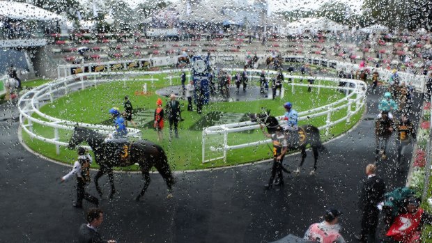 Delayed: Wet conditions at last year's The Championships at Randwick race course. This year's event has been postponed until Monday.