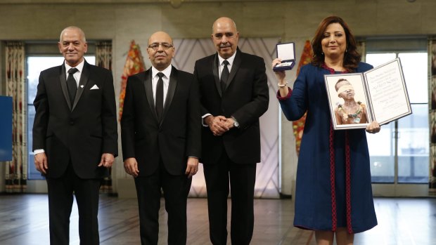 Representatives of the Tunisian National Dialogue Quartet, from left to right,  Houcine Abassi, Mohamed Fadhel Mahfoudh, Abdessattar Ben Moussa and Wided Bouchamaoui, receiving the 2015 Nobel Peace Prize in Oslo on December 10.