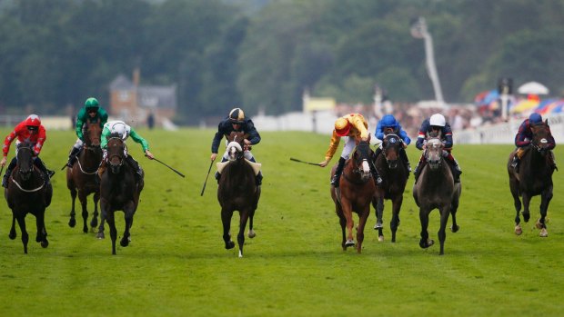 Down the straight: Ryan Moore riding Twilight Son (centre left) wins the Diamond Jubilee Stakes at Royal Ascot.