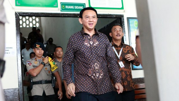 Jakarta's governor Ahok, centre, is on trial for  blasphemy after mass rallies, spearheaded by Islamic hardliners, called for him to be jailed.