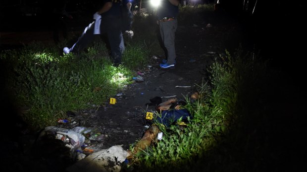 The body of an alleged drug dealer in Manila, Philippines. 
