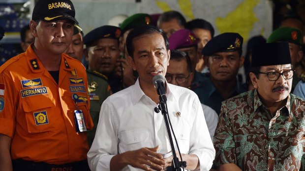 "We also feel the loss from this tragedy": Indonesian President Joko Widodo (centre).