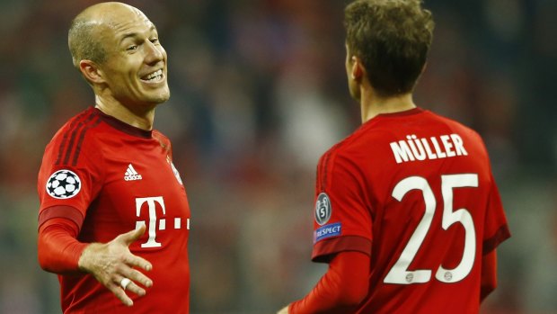 Happy days: Bayern's Arjen Robben, left, celebrates with Thomas Mueller.
