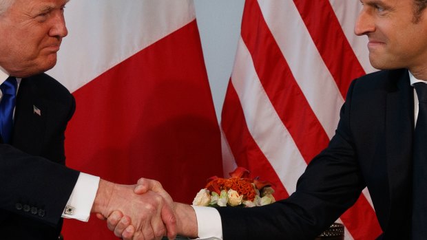 President Donald Trump shakes hands with French President Emmanuel Macron during a meeting at the U.S. Embassy, Thursday, May 25, 2017, in Brussels. (AP Photo/Evan Vucci)