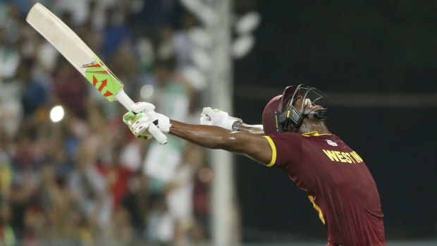 Last over hero Carlos Brathwaite celebrates hitting the winning runs.