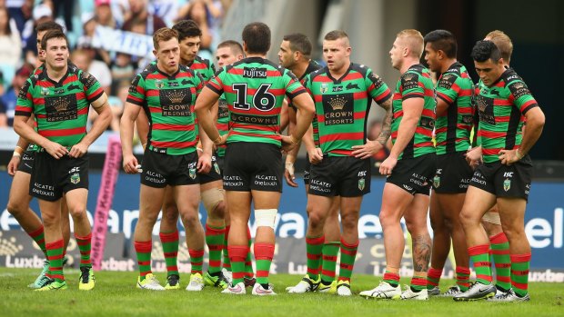 Miserable: The Rabbitohs look dejected after a try.