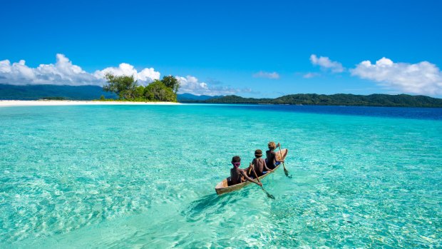 Kids paddling along the beautiful islands of Marau Sound. 