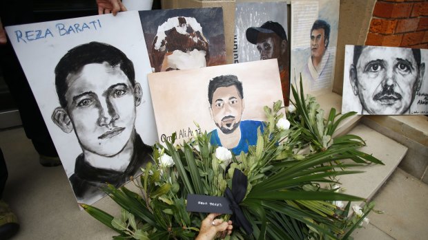 A depiction of Reza Barati, who was killed on Manus Island, and other people who died in Australian immigration detention centres are seen during a rally in front of Prime Minister Malcolm Turnbull's electoral office in Edgecliff in March 2016.