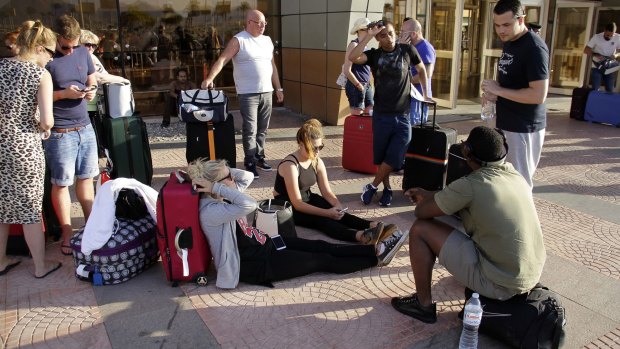 Russian passengers wait outside the Sharm el-Sheikh Airport.